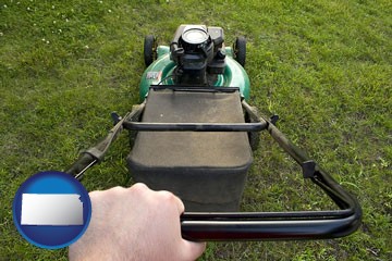 using a power lawn mower to maintain the appearance of a lawn - with Kansas icon