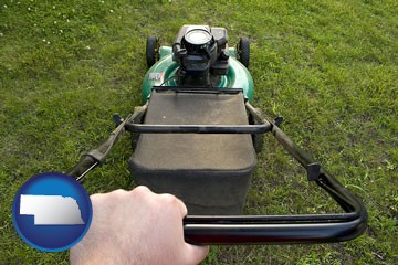 using a power lawn mower to maintain the appearance of a lawn - with Nebraska icon