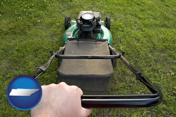 using a power lawn mower to maintain the appearance of a lawn - with Tennessee icon