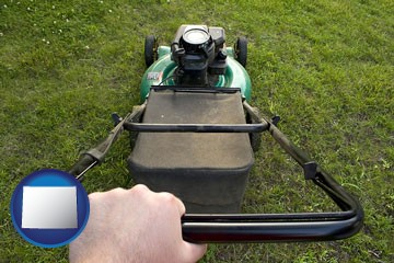 using a power lawn mower to maintain the appearance of a lawn - with Wyoming icon